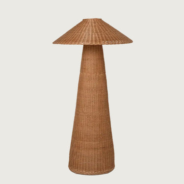 Wicker floor lamp with a cone-shaped base and woven shade on a white background