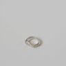 Small silver metal ring on a gray background