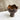 Ceramic vase with wavy top on a marble surface