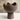 Ceramic vase with a unique design on a neutral background