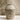 Speckled ceramic vase on a neutral background