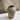 Stoneware vase on a marble surface with a neutral background