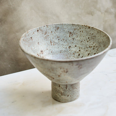 Ceramic bowl with textured surface on a marble surface