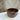 Brown ceramic bowl on a marble surface with a gray background